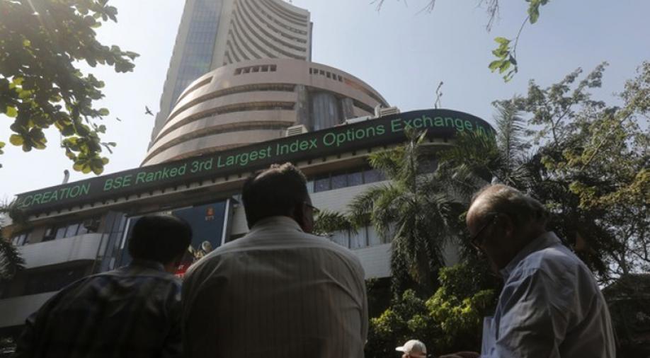 Sensex rises 300 points on earnings optimism