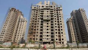 GST on under-construction flats slashed to 5%; affordable housing to attract 1%
