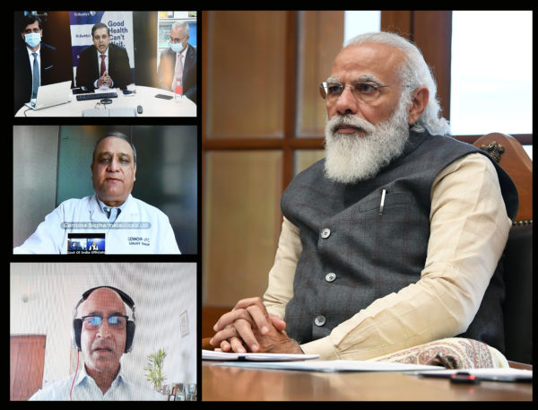Narendra Modi interacts with three teams working on developing and manufacturing COVID-19 vaccine